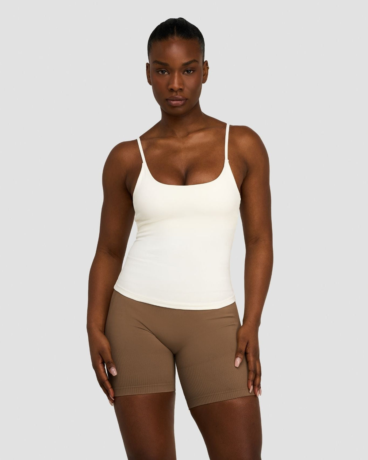 Elevate Sculpting Seamless Scoop Neck Cami in Cream, front view styled with brown shorts