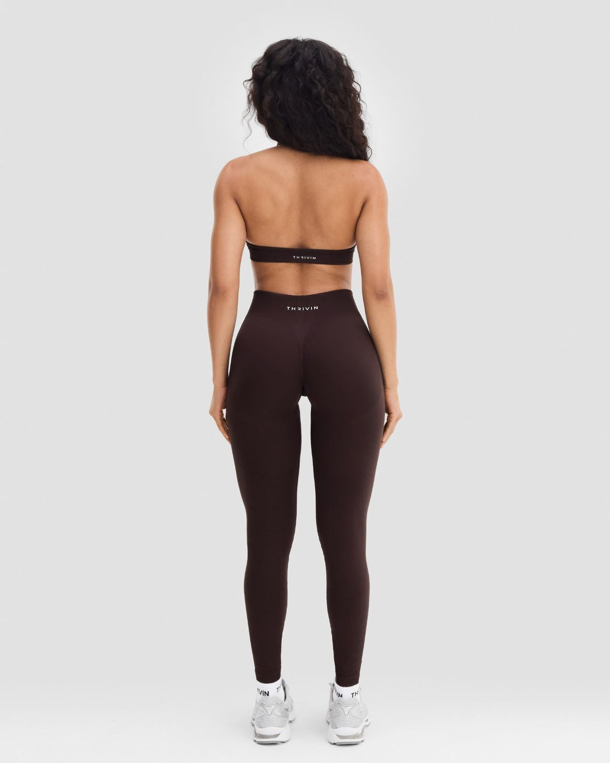 Elevate Sculpting Seamless Adjustable Halter Bra in Coffee Brown, full-length back view with halter bra and leggings