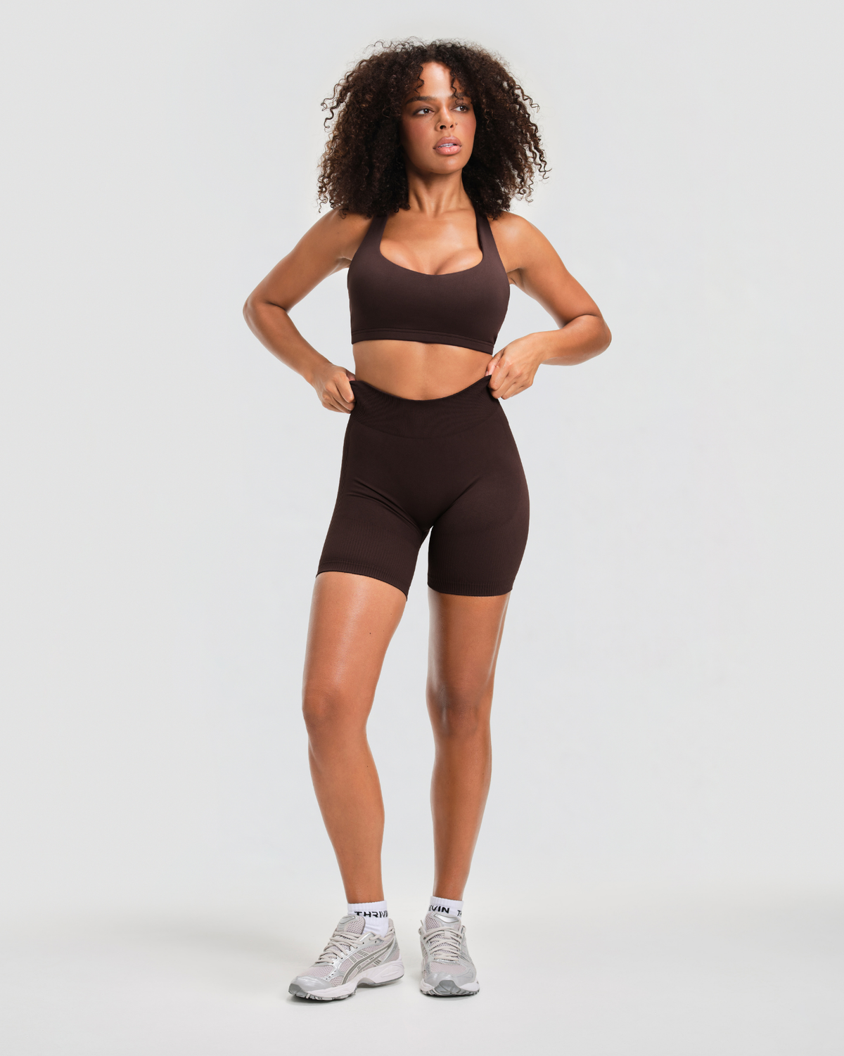 Elevate Sculpting Mid Waist Scrunch Shorts in Coffee Brown, full-length front view with mid waistband and matching sports bra