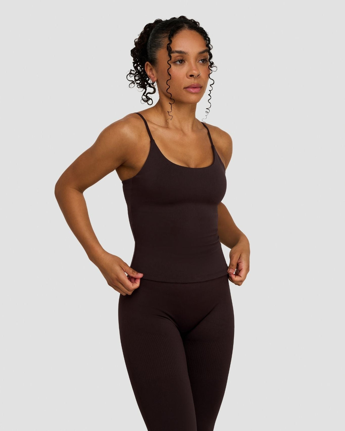 Elevate Sculpting Seamless Scoop Neck Cami in Coffee Brown, three-quarter front view with hand on hip