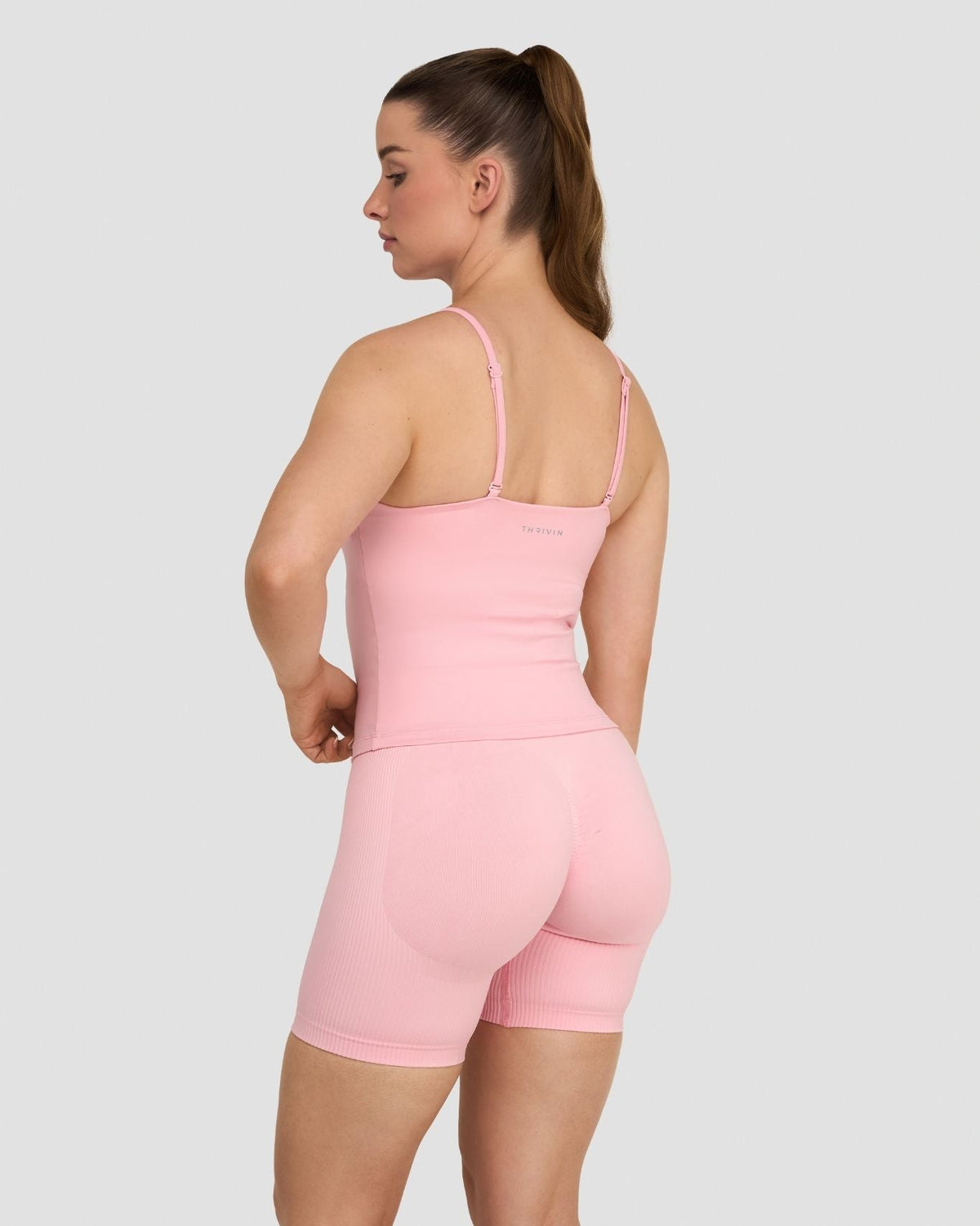 Elevate Sculpting Seamless Scoop Neck Cami in Cotton Pink, back three-quarter view with thin straps and matching shorts