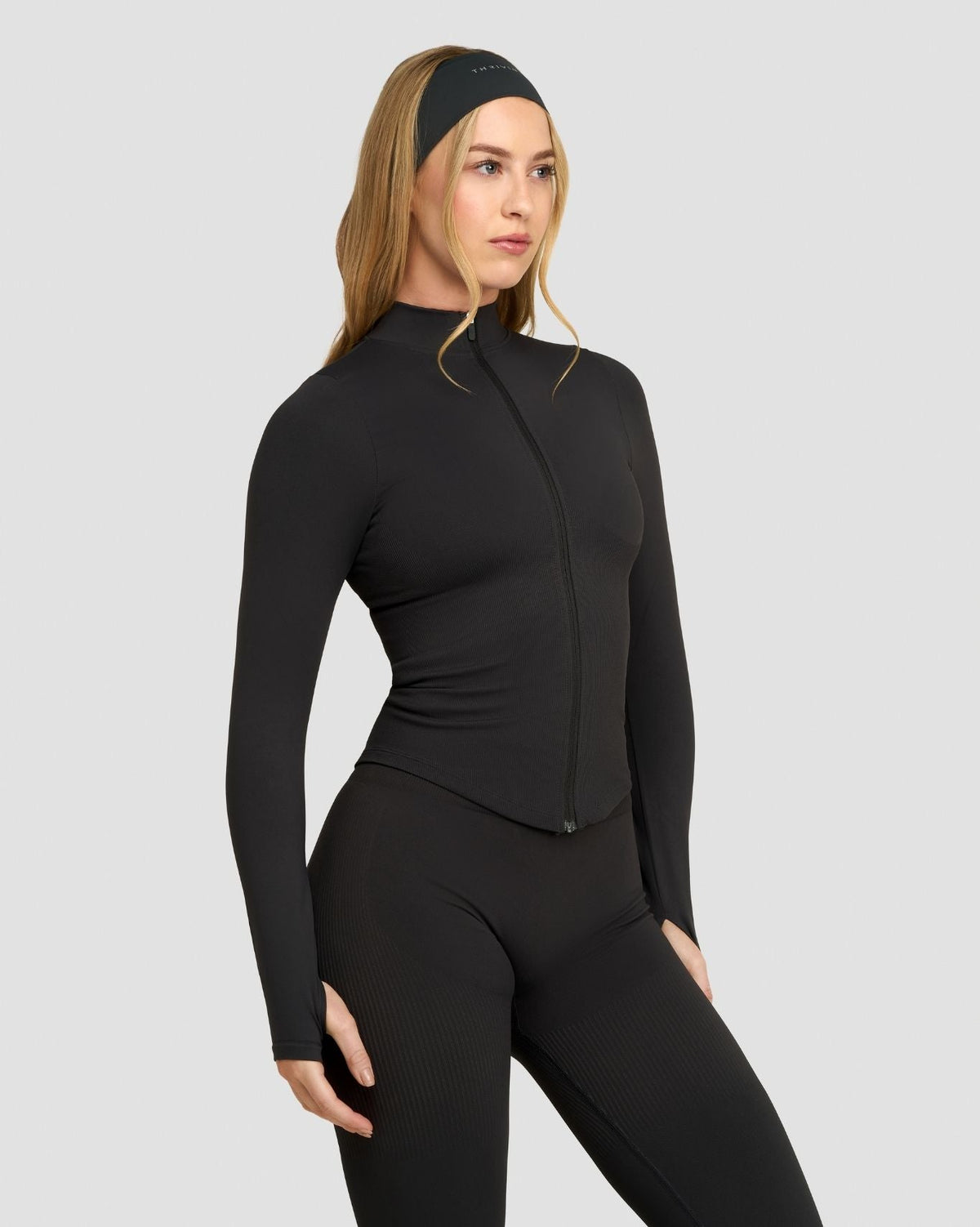 Elevate Compression Long Sleeve Jacket in Charcoal Grey, three-quarter front view with zip front