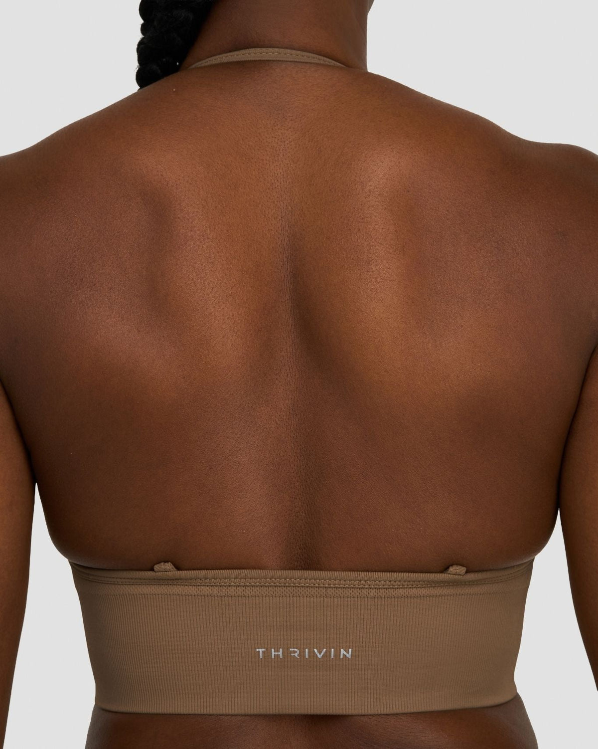 Elevate Multiway Sculpt Seamless Bra in Toffee, back close-up of open back and THRIVIN logo band