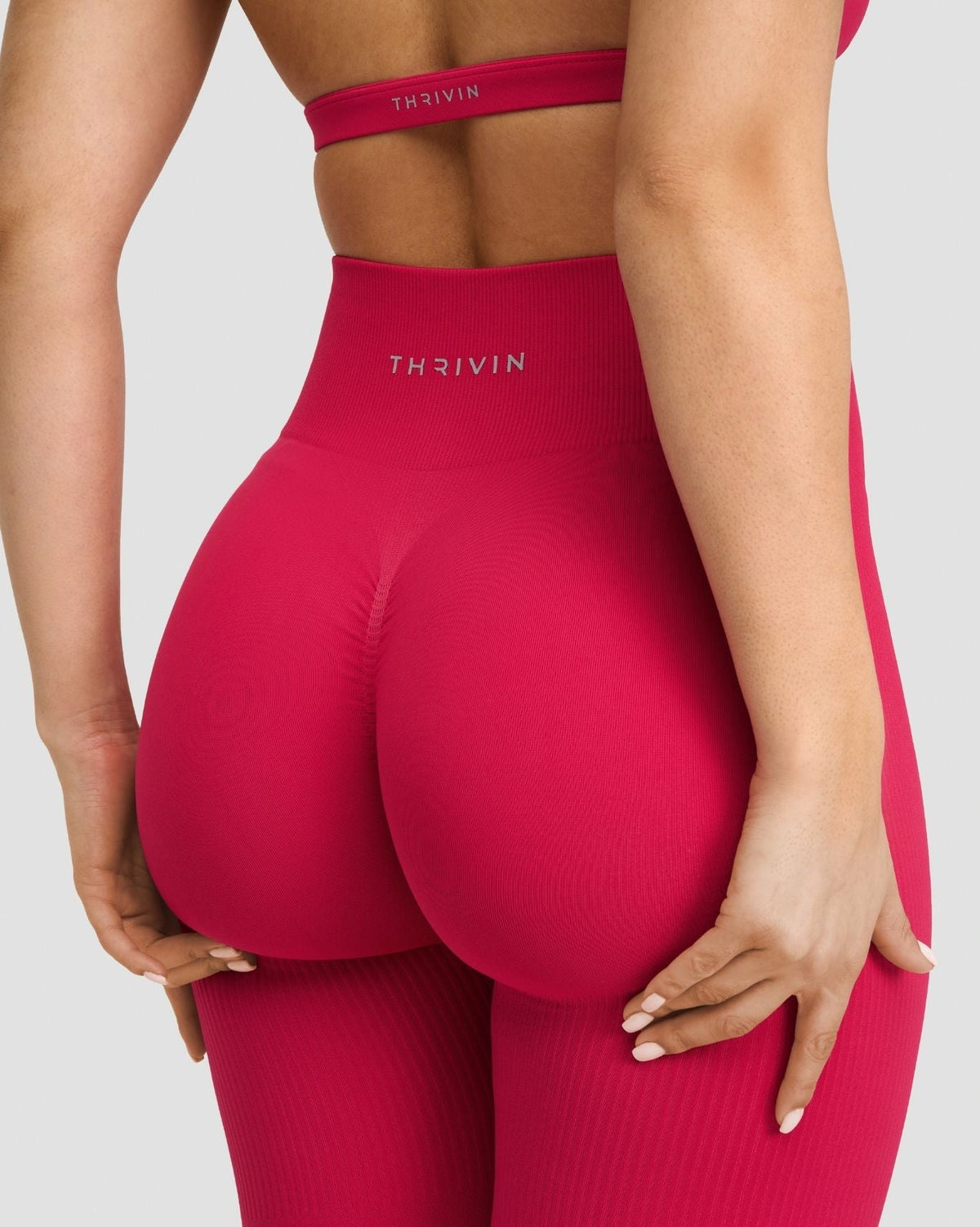 Elevate Sculpting High Waist Scrunch Leggings in Strawberry, back close-up of scrunch seam and THRIVIN logo waistband