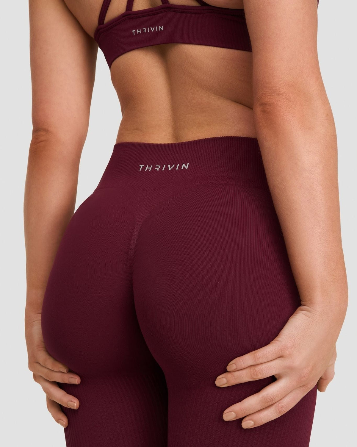Elevate Sculpting Mid Waist Scrunch Leggings in Merlot, back close-up of THRIVIN waistband and seamless fit