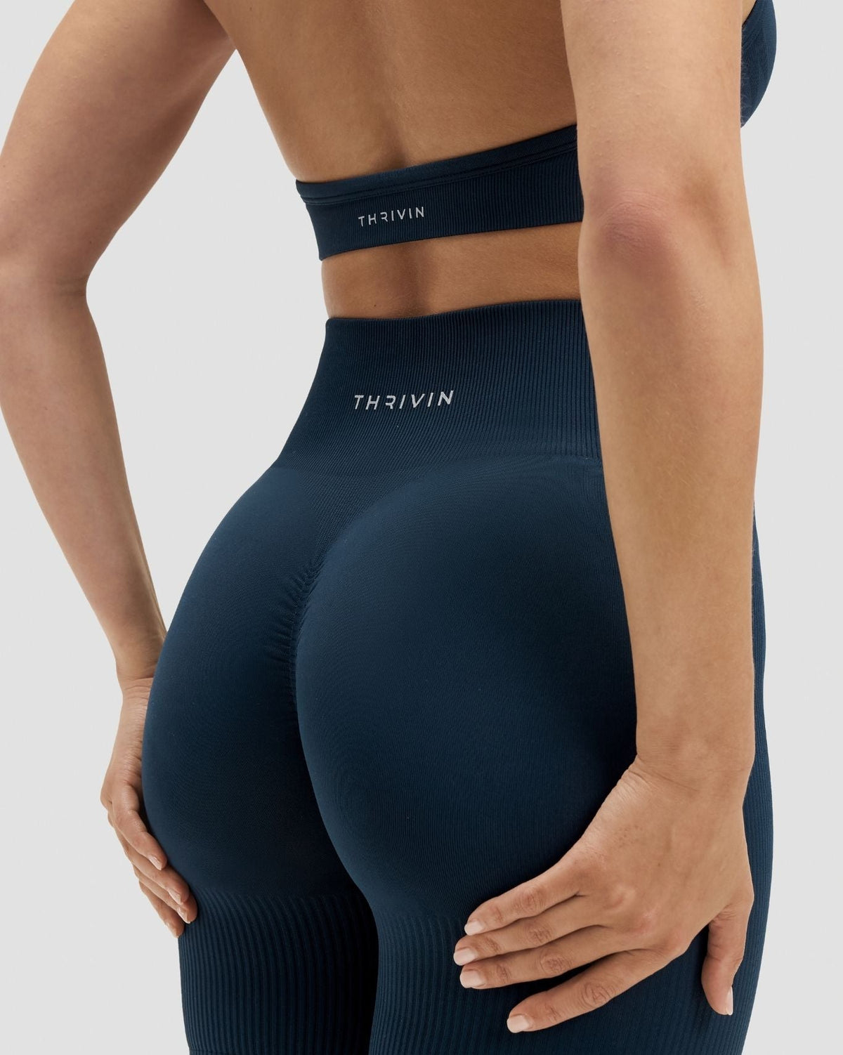 Elevate Sculpting High Waist Scrunch Shorts in Midnight Navy Blue, back close-up of scrunch seam and THRIVIN waistband