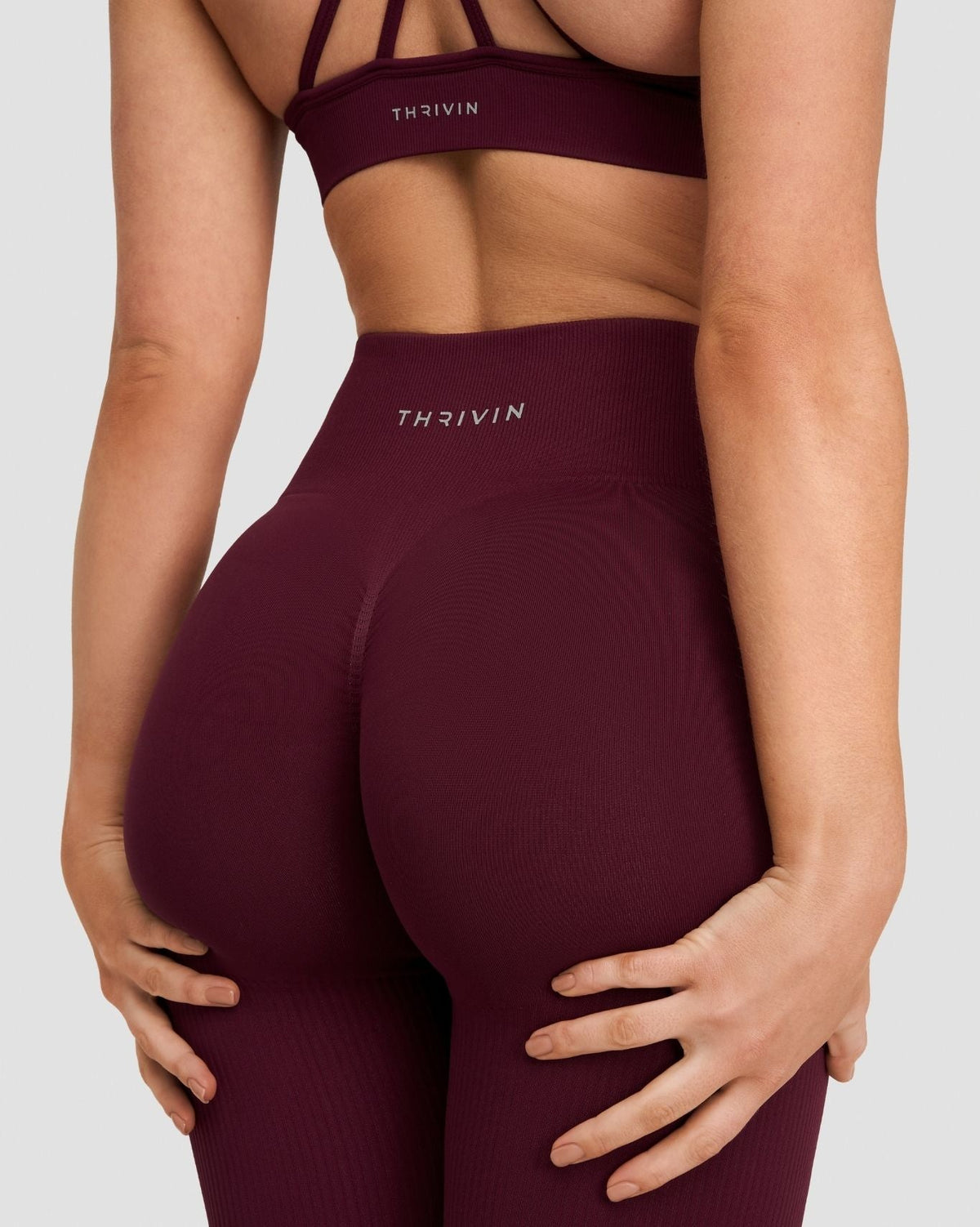 Elevate Sculpting High Waist Scrunch Leggings in Merlot, back close-up of waistband Thrivin logo and scrunch seam