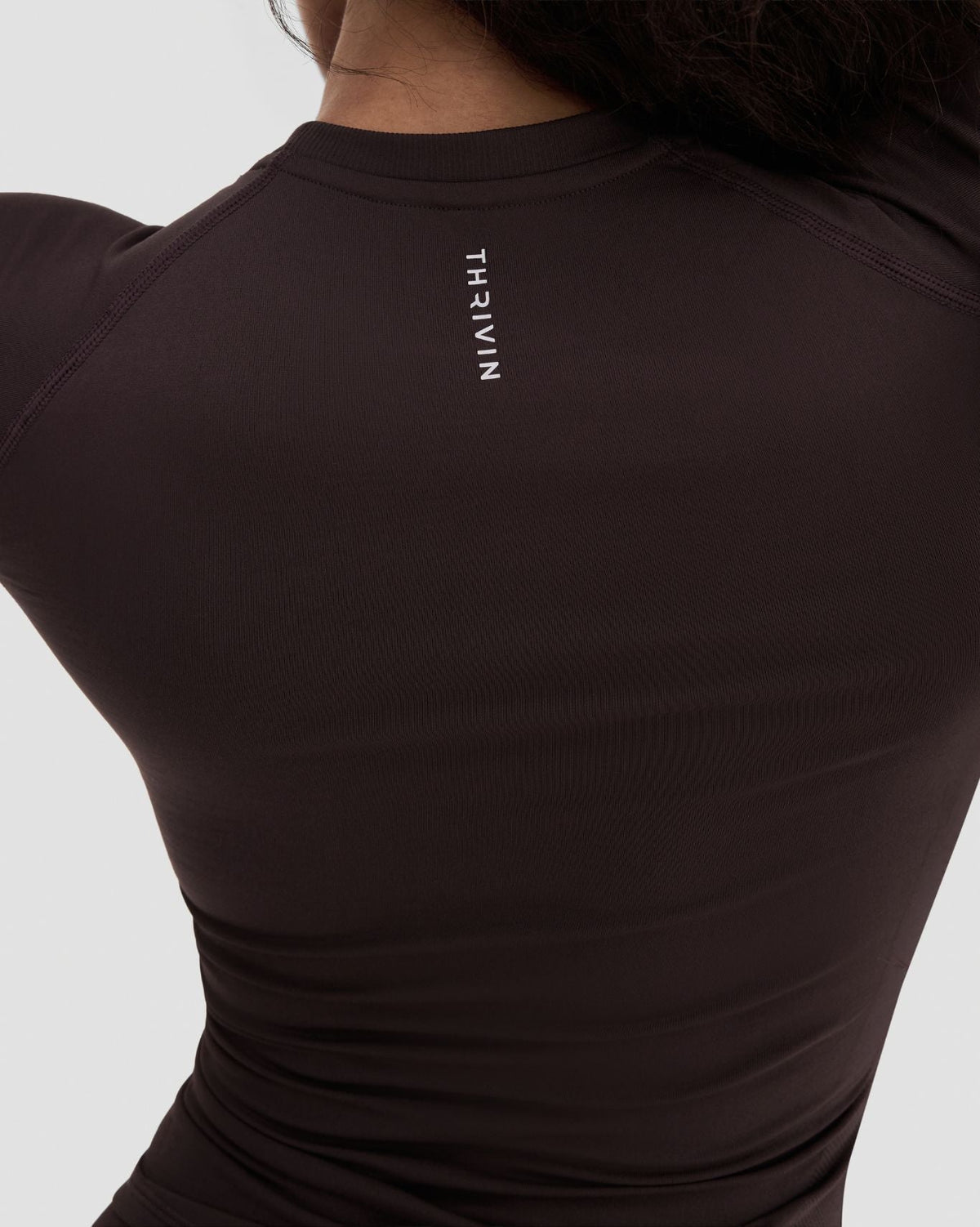 Elevate Compression T-Shirt in Coffee Brown, back close-up of shoulder and Thrivin logo detail