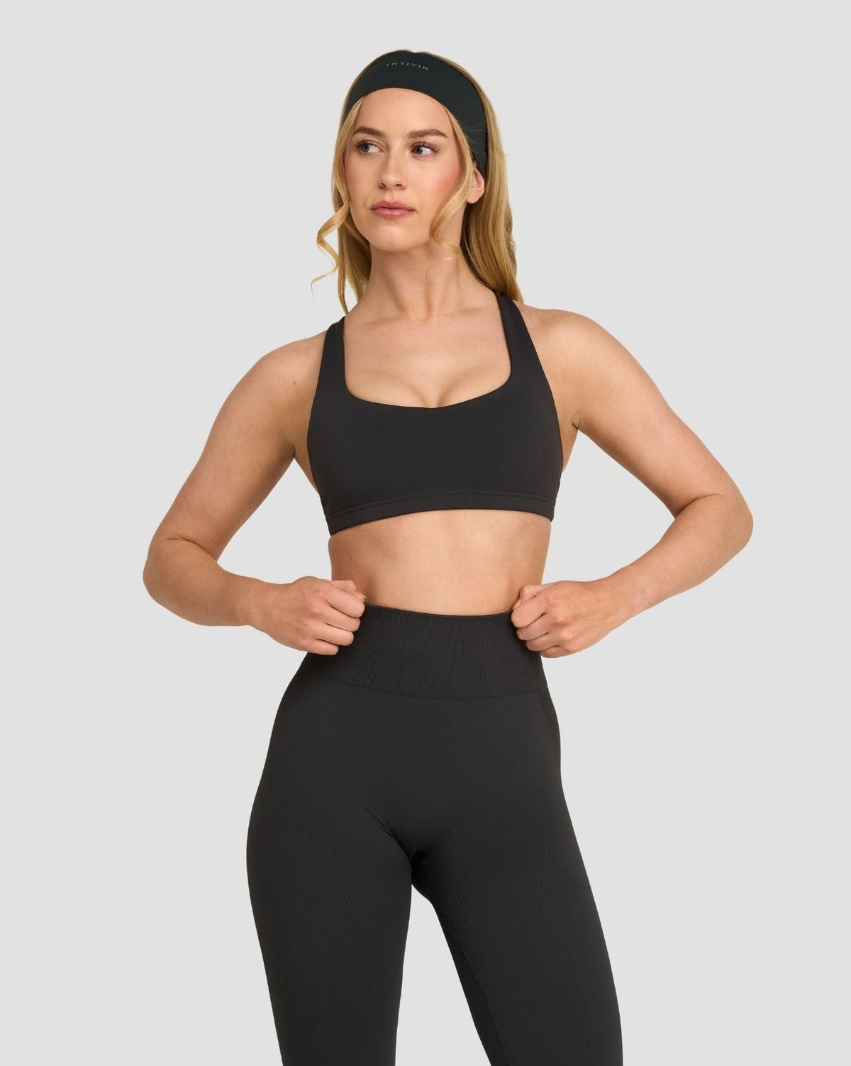 Elevate Sculpting Medium Impact Multiway Bra in Charcoal Grey, front view, hands on hips