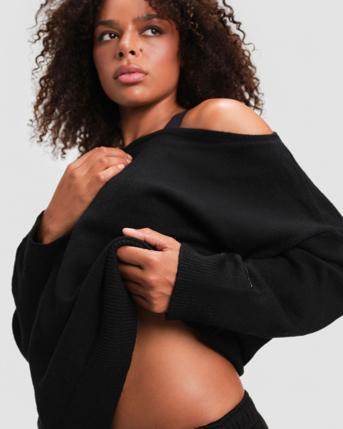 The Essential Collection Off The Shoulder Wool Blend Sweater in Night Black, close-up of soft wool blend knit and ribbed cuff