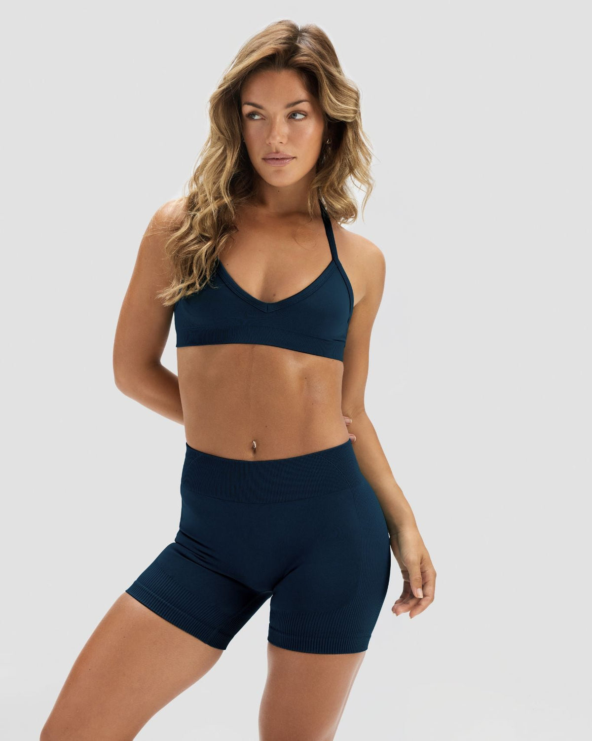 Elevate Sculpting Mid Waist Scrunch Shorter Shorts in Midnight Navy Blue, front view with wide waistband and ribbed knit