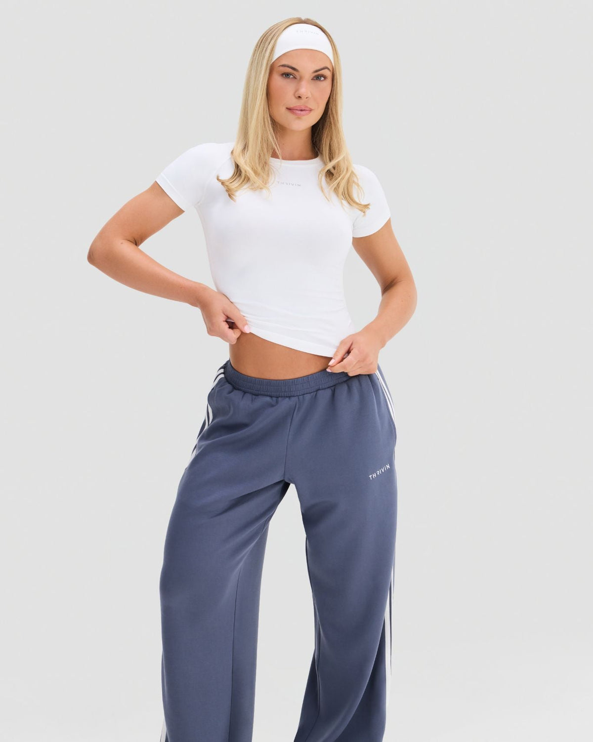 Elevate Compression T-Shirt in White, front view of the gym T-shirt with raglan short sleeves and waist-length hem