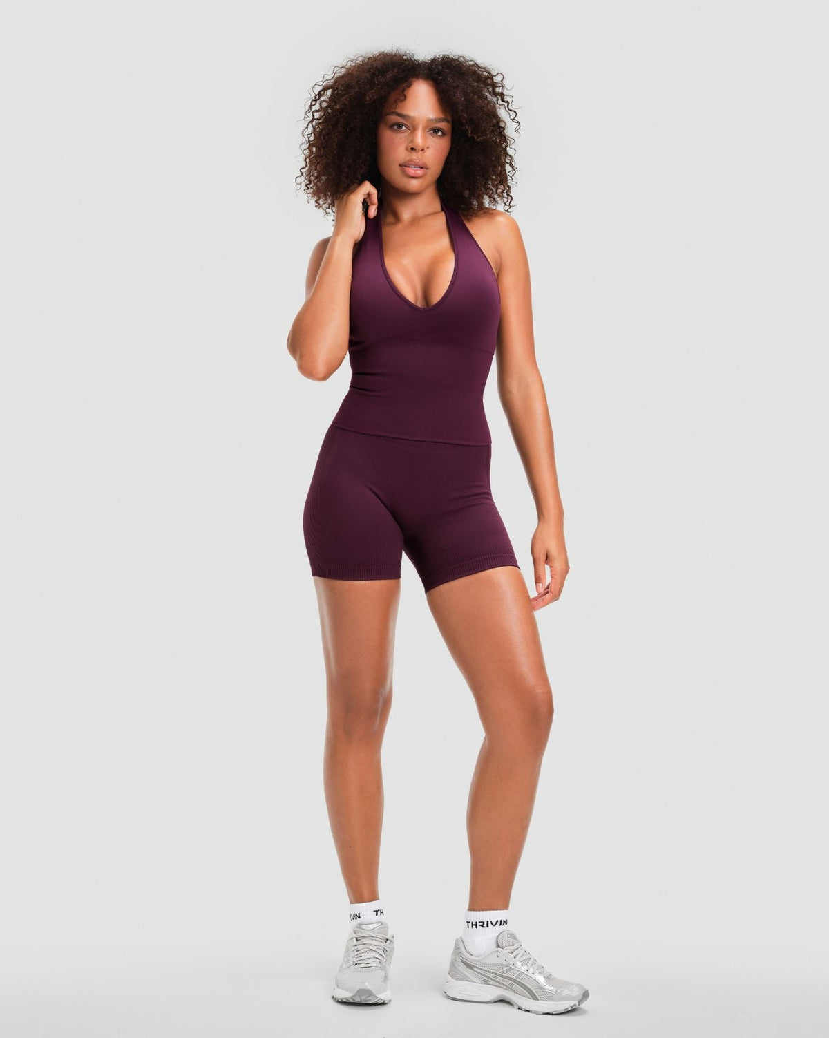 Elevate Sculpting Seamless Halterneck Top in Winter Plum Red, full-length front view with halter neckline and plunge V-neck