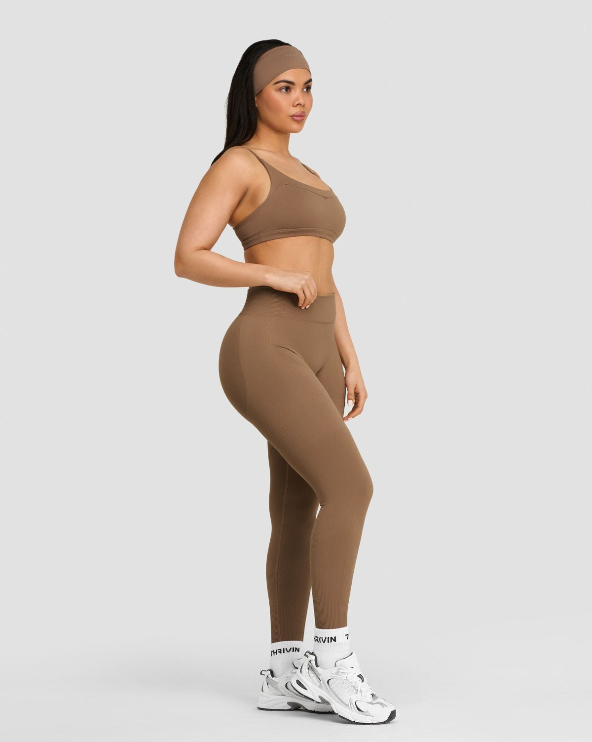 Elevate Sculpting Mid Waist Scrunch Leggings in Toffee, full-length three-quarter view styled with matching bra