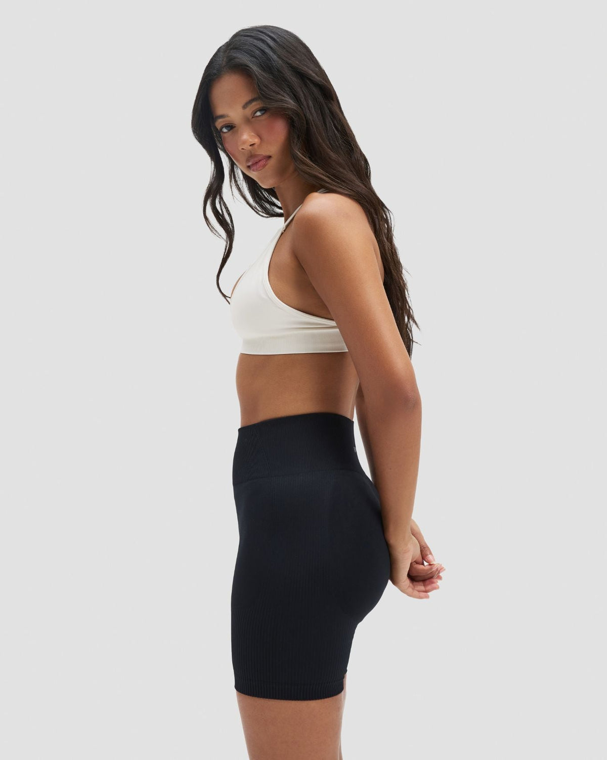 Elevate Sculpting High Waist Scrunch Shorts in Night Black, side view with high waistband and ribbed texture