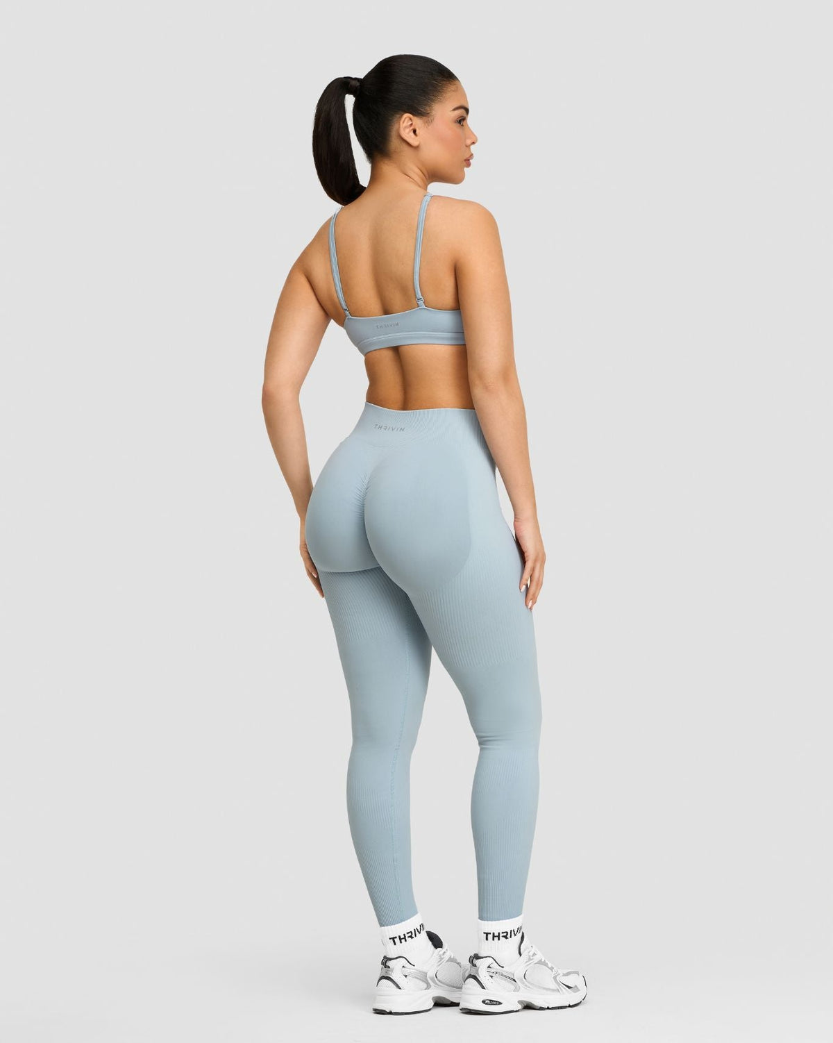 Elevate Sculpting Mid Waist Scrunch Leggings in Blue Haze, full-length back view with scrunch seam
