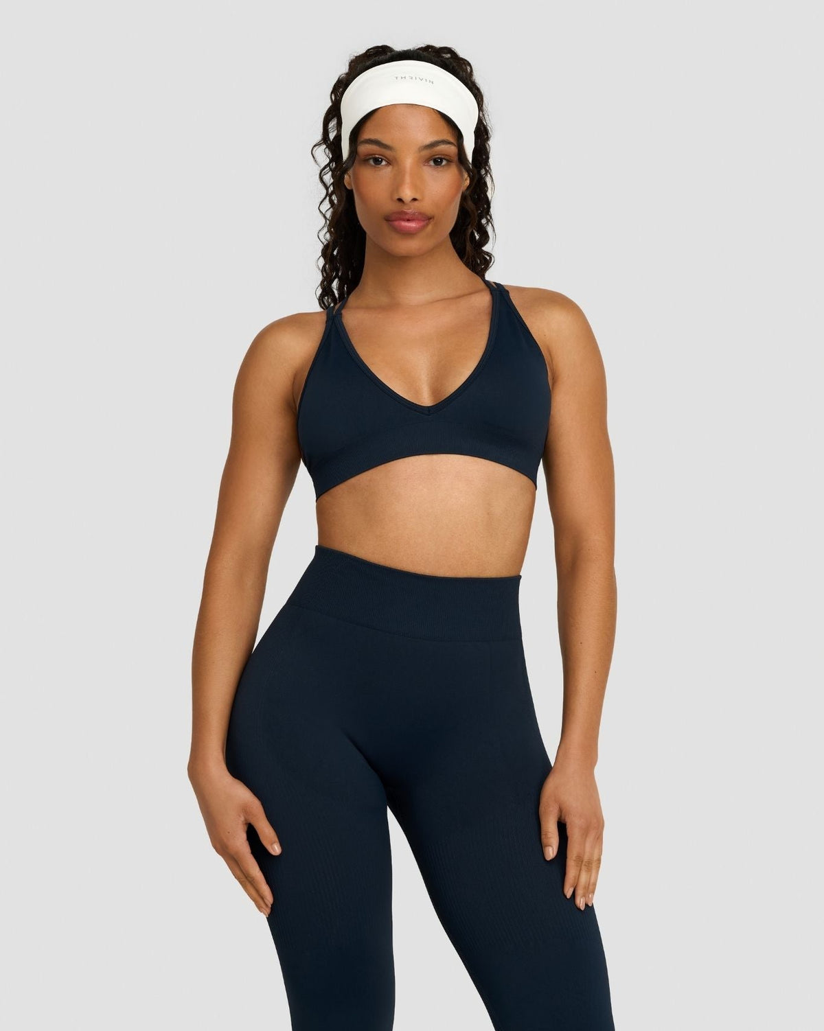 Elevate Sculpting Seamless High Apex Bra in Midnight Navy Blue, front view with matching leggings