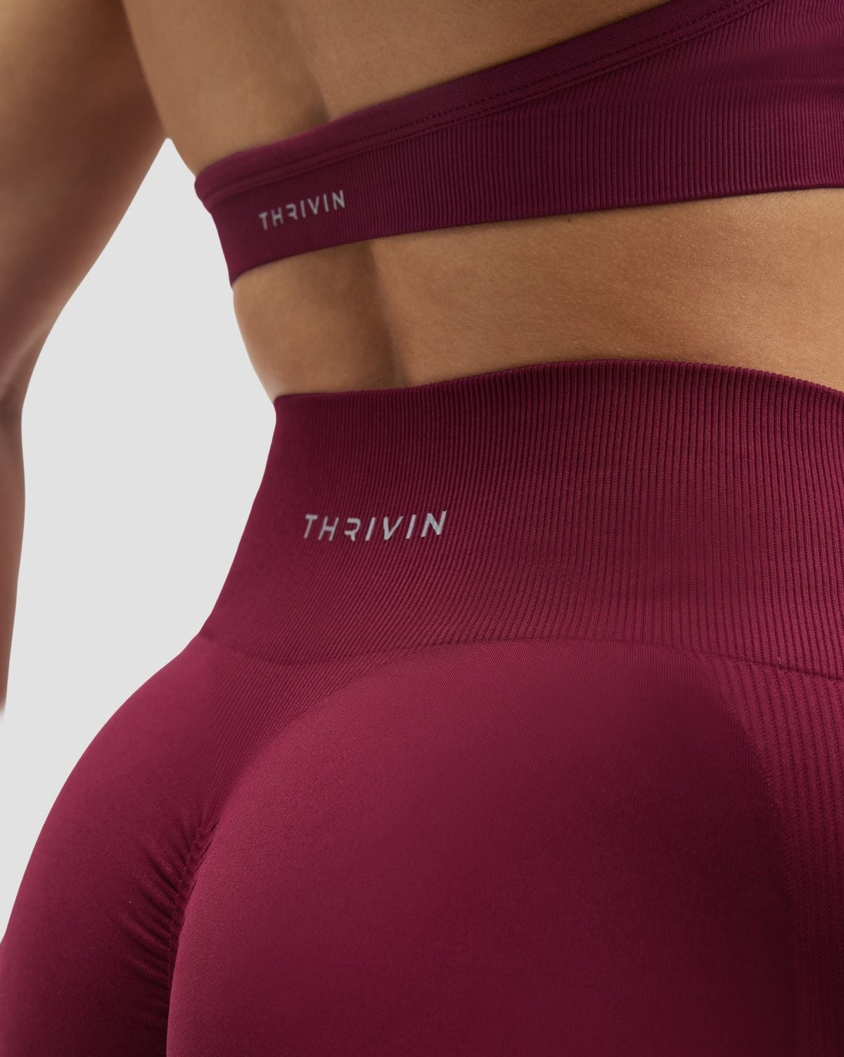 Elevate Sculpting High Waist Scrunch Leggings in Cherry Berry, back close-up of waistband with THRIVIN logo