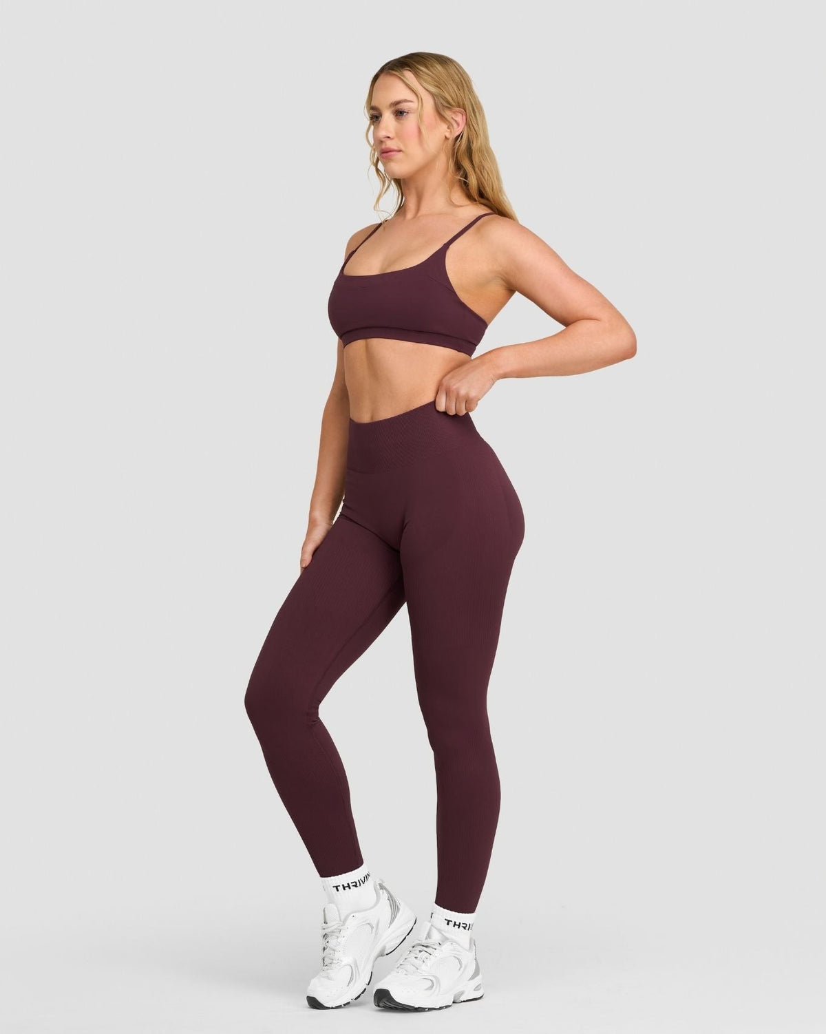 Elevate Sculpting High Waist Scrunch Leggings in Dark Mauve, three-quarter front view with high waist, styled with sports bra