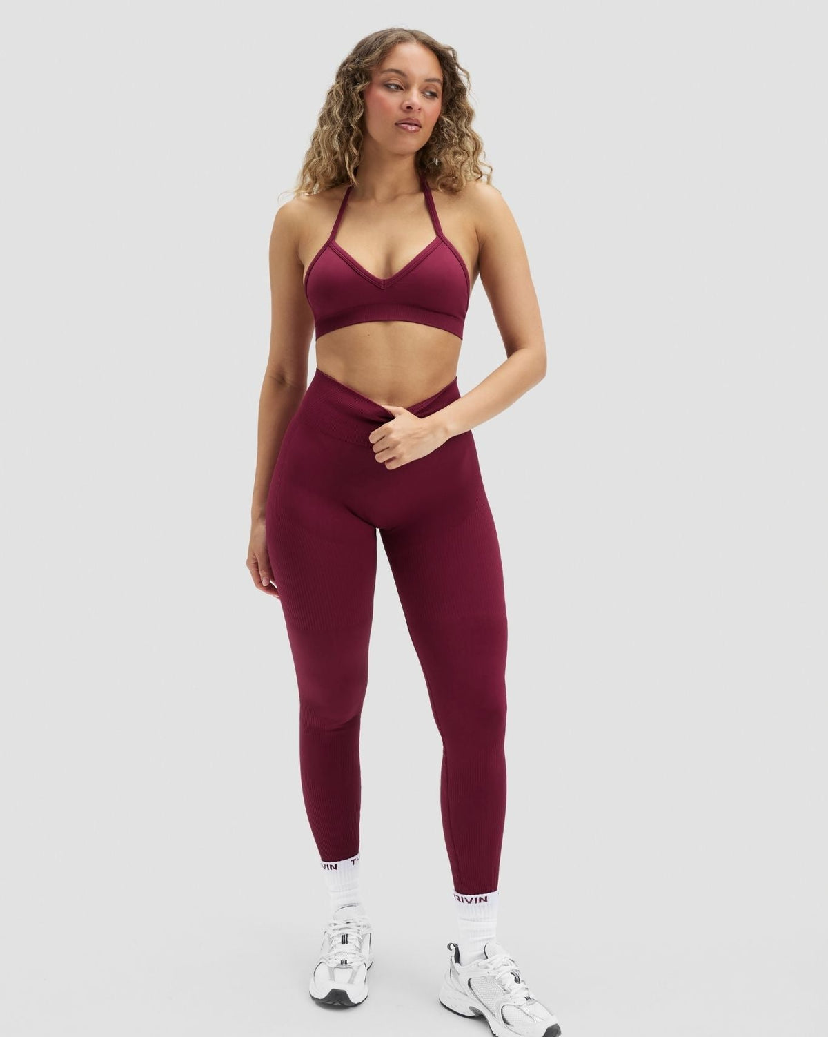 Elevate Sculpting High Waist Scrunch Leggings in Cherry Berry, front view styled with matching bra, hands in hair