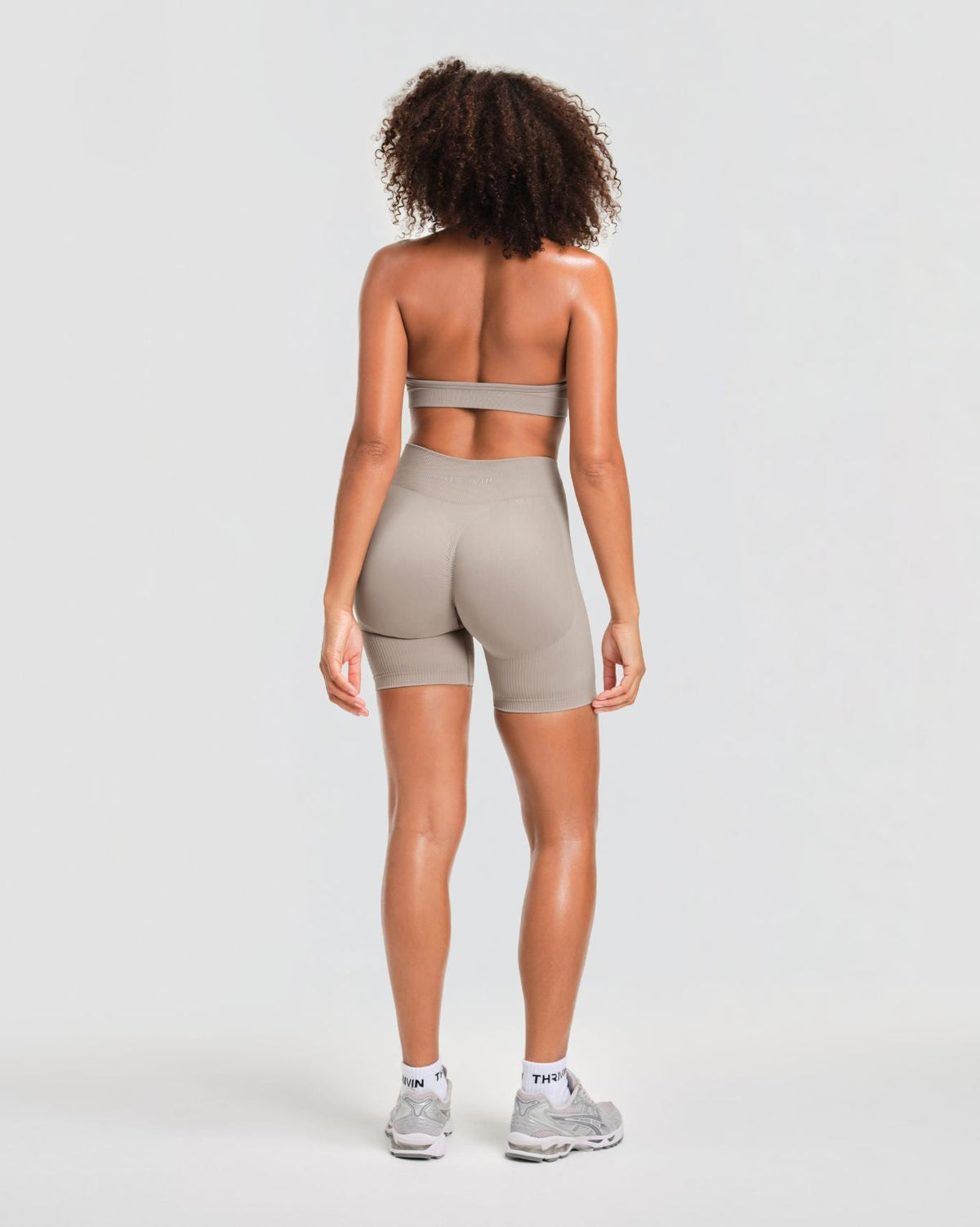 Elevate Sculpting Mid Waist Scrunch Shorts in Latte Grey, full-length back view of contoured seat and mid waist rise