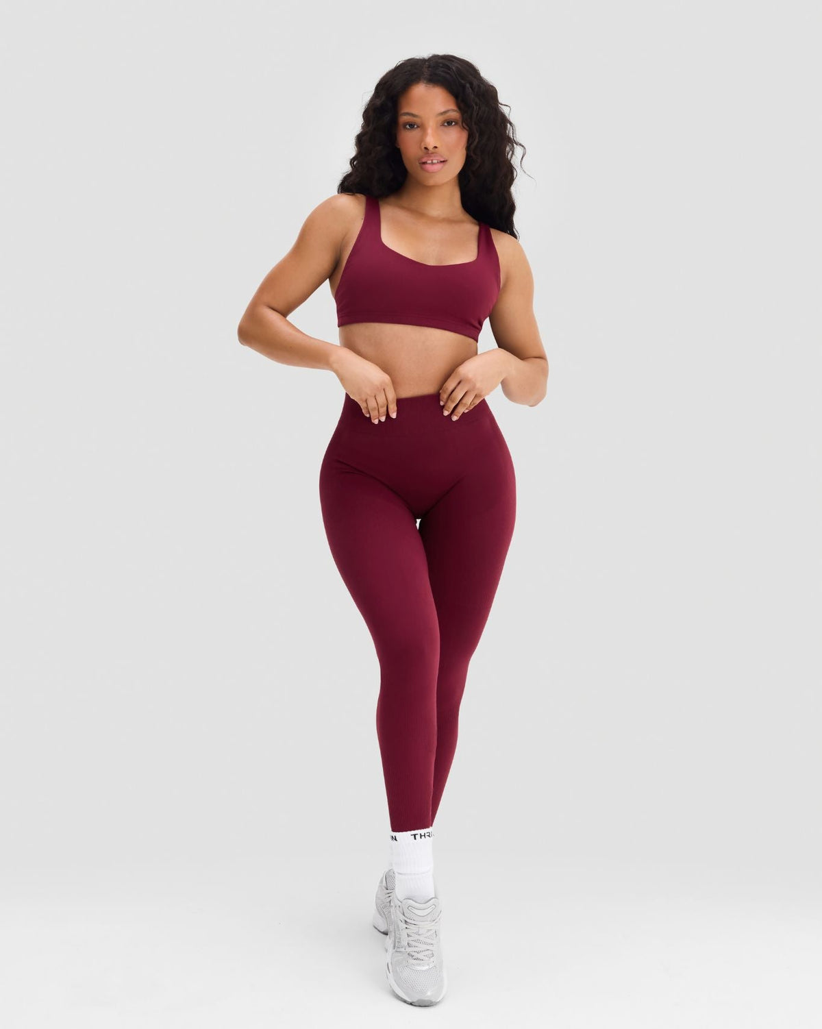 Elevate Sculpting Mid Waist Scrunch Leggings in Fine Wine Red, full-length front view styled with matching bra
