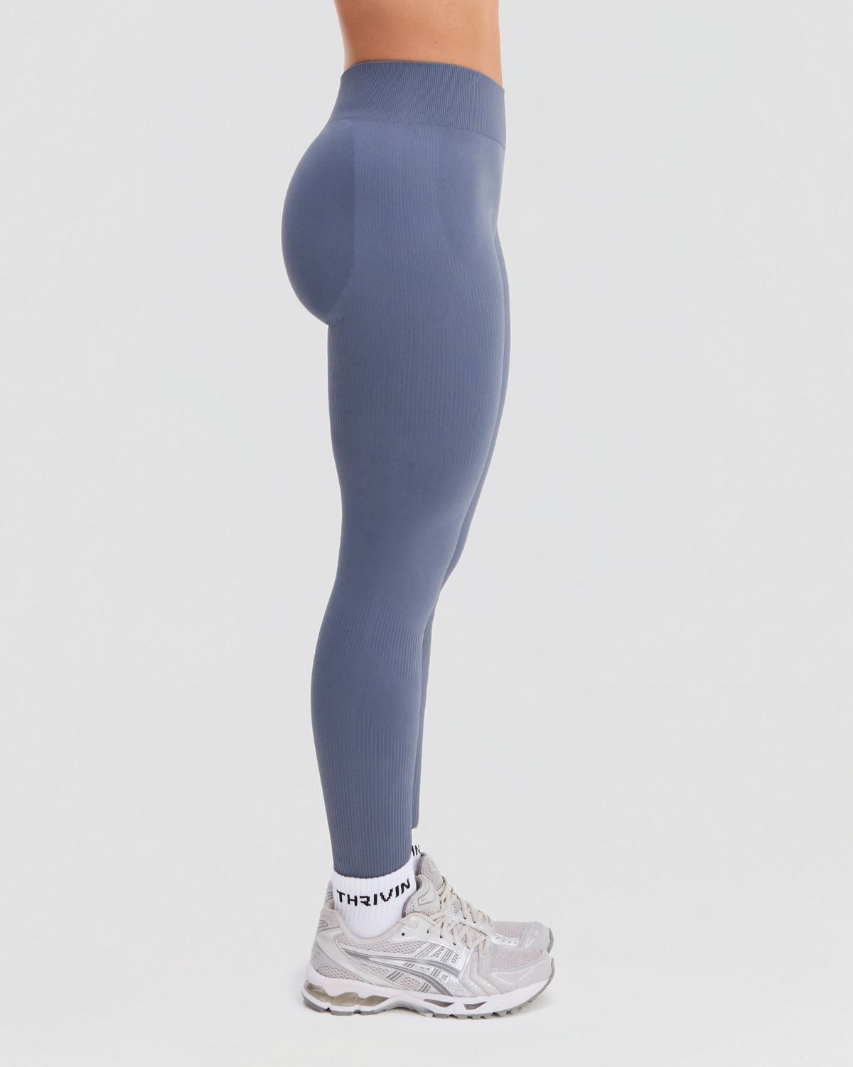 Elevate Sculpting Mid Waist Scrunch Leggings in Steel Blue, side view from waist to ankle with mid waist rise and ribbed knit