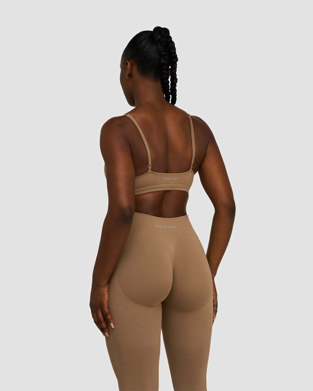 Elevate Sculpting Seamless Scoop Neck Bra in Toffee, back view of thin straps, styled with matching leggings