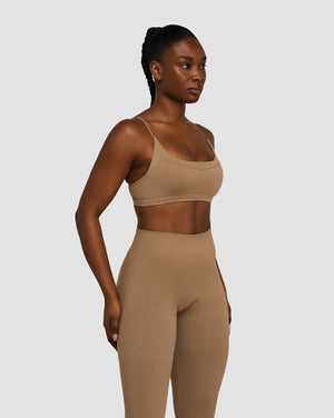 Elevate Sculpting Seamless Scoop Neck Bra in Toffee, three-quarter front view with scoop neck, styled with matching leggings