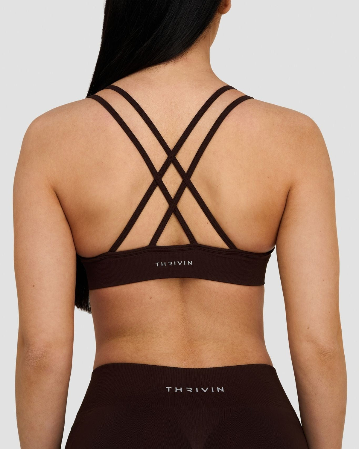 Elevate Sculpting Seamless High Apex Bra in Coffee Brown, back close-up of crisscross straps and THRIVIN logo band