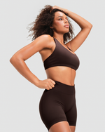 Elevate Sculpting Mid Waist Scrunch Shorter Shorts in Coffee Brown, three-quarter front view of mid waistband and ribbed knit