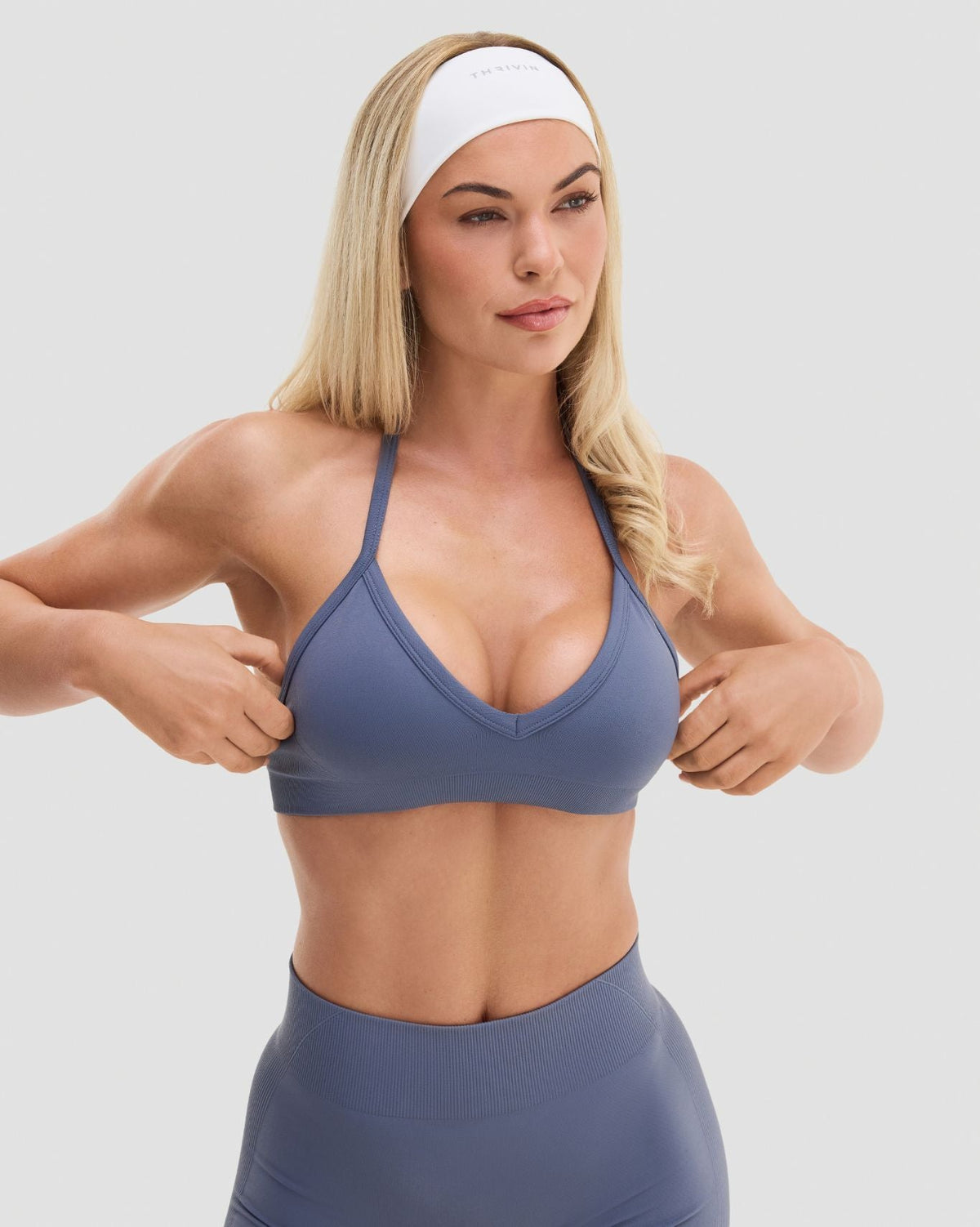 Elevate Sculpting Seamless Adjustable Halter Bra in Steel Blue, front close-up of V-neckline and halter straps in smooth knit