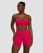 Elevate Sculpting Seamless Scoop Neck Bra in Strawberry, front three-quarter view, styled with matching shorts