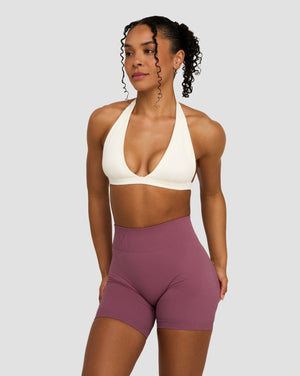 Elevate Sculpting Seamless V-Neck Halter Bra in Cream, front view with Orchid Mauve shorts