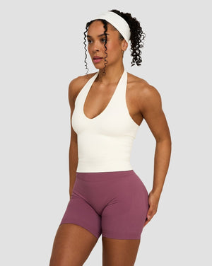 Elevate Sculpting Seamless Halterneck Top in Cream, front view styled with mauve shorts and headband