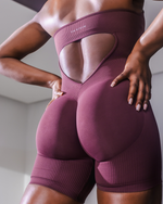 Elevate Sculpting Halterneck All In One in Dark Mauve, back close-up of open back with THRIVIN logo
