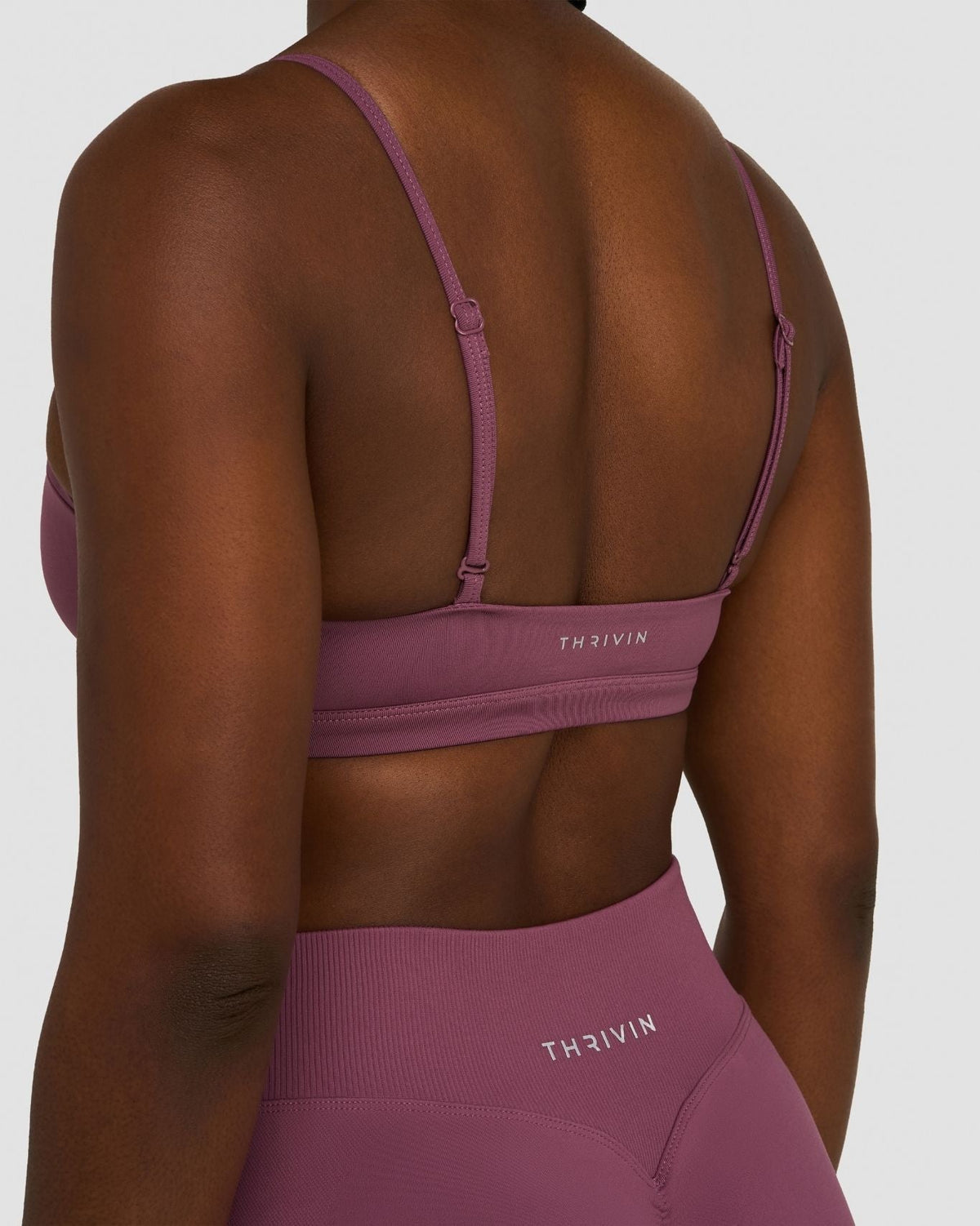 Elevate Sculpting Seamless Scoop Neck Bra in Orchid Mauve, back close-up of THRIVIN logo band and adjustable straps