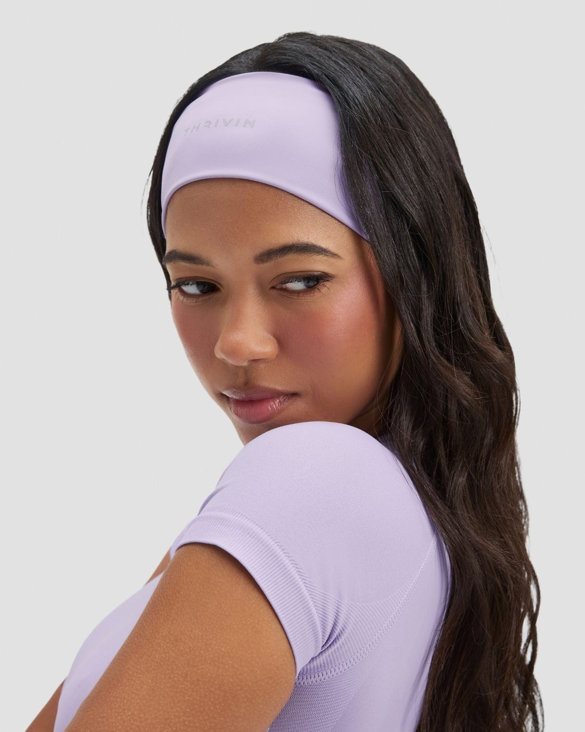 The Essential Collection Chrome Logo Headband in Lilac, side close-up of wide band styled with matching top