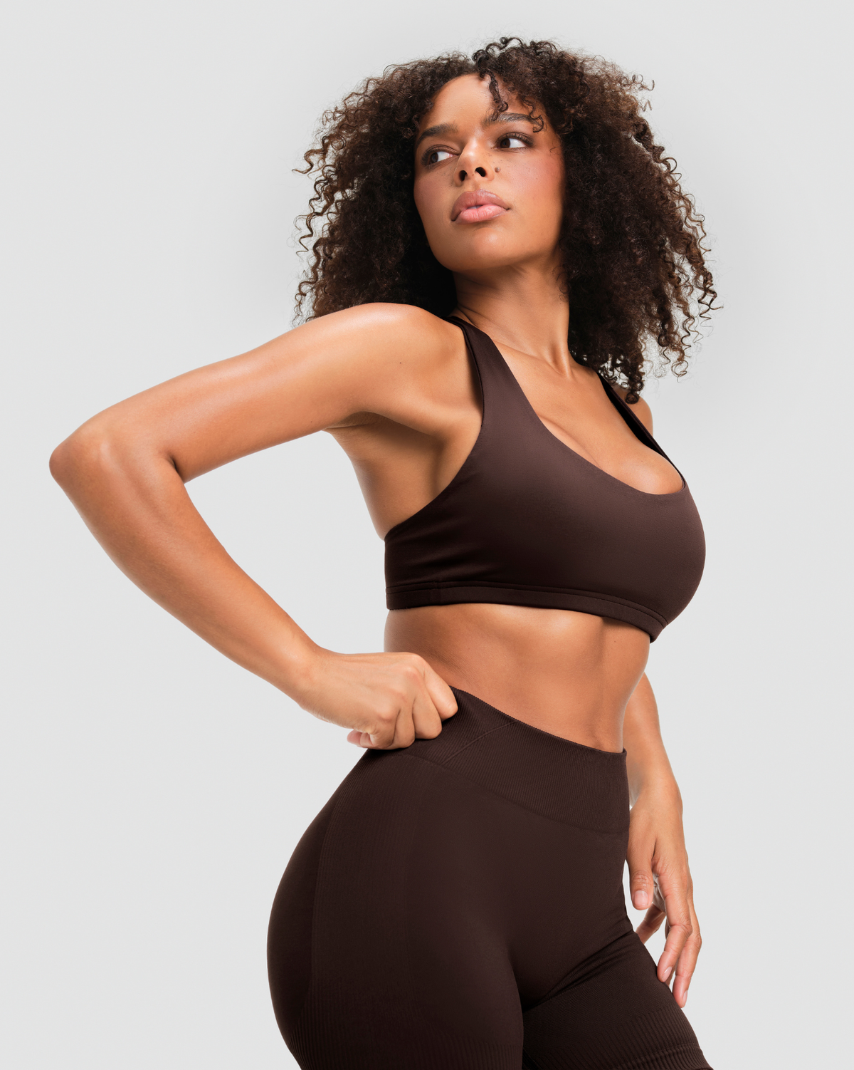 Elevate Sculpting Mid Waist Scrunch Shorter Shorts in Coffee Brown, close-up of the wide mid waistband at the natural waist