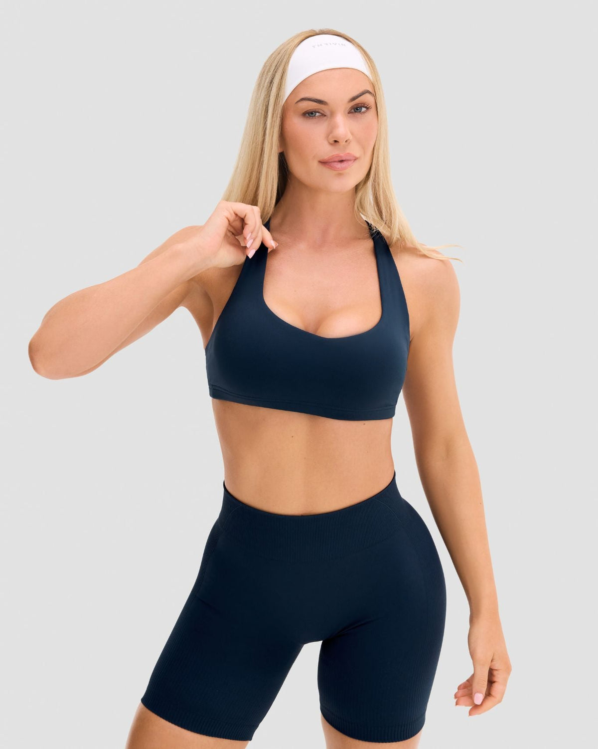 Elevate Sculpting Medium Impact Multiway Bra in Midnight Navy Blue, front view styled with matching shorts