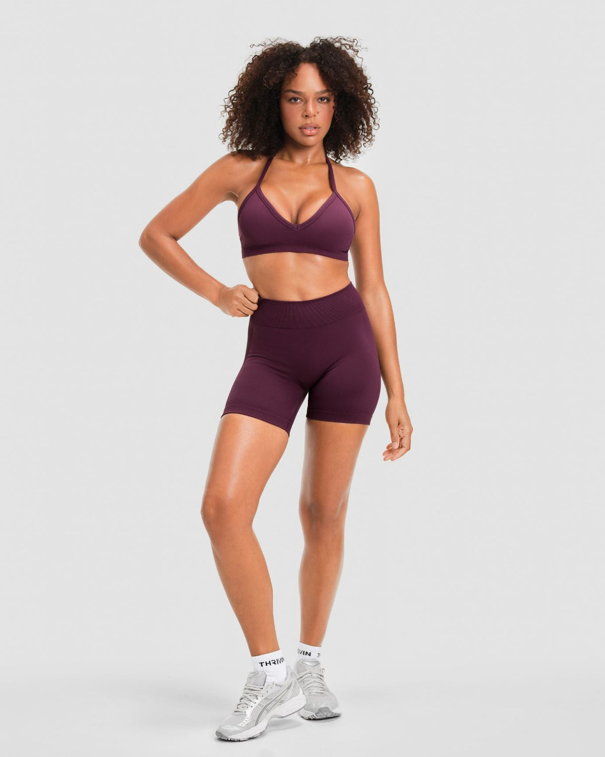 Elevate Sculpting Mid Waist Scrunch Shorter Shorts in Winter Plum Red, full-length front view of mid waist and shorter inseam