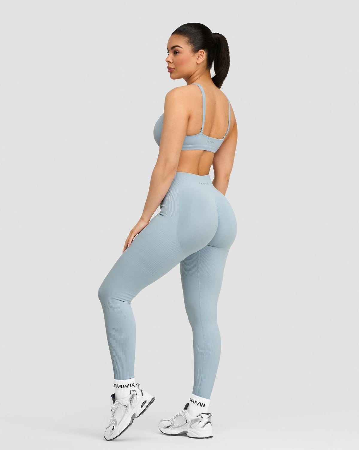 Elevate Sculpting Mid Waist Scrunch Leggings in Blue Haze, three-quarter back view with sculpting fit