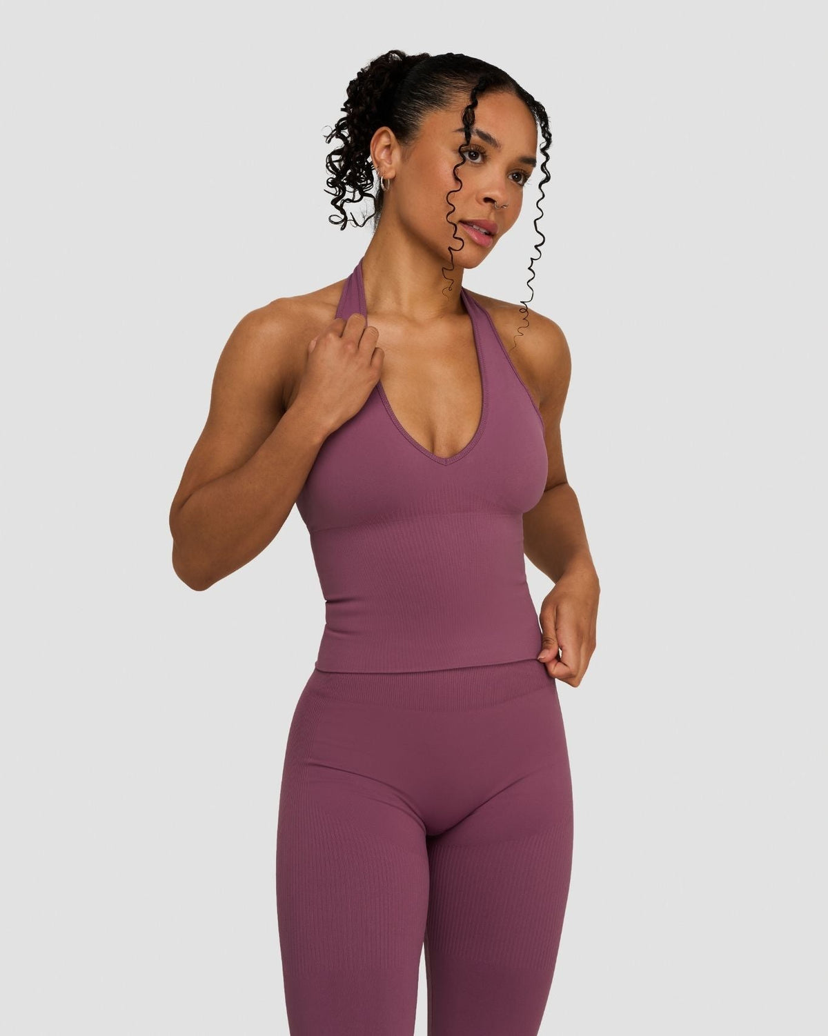 Elevate Sculpting Seamless Halterneck Top in Orchid Mauve, front view of halterneck top, looking over shoulder
