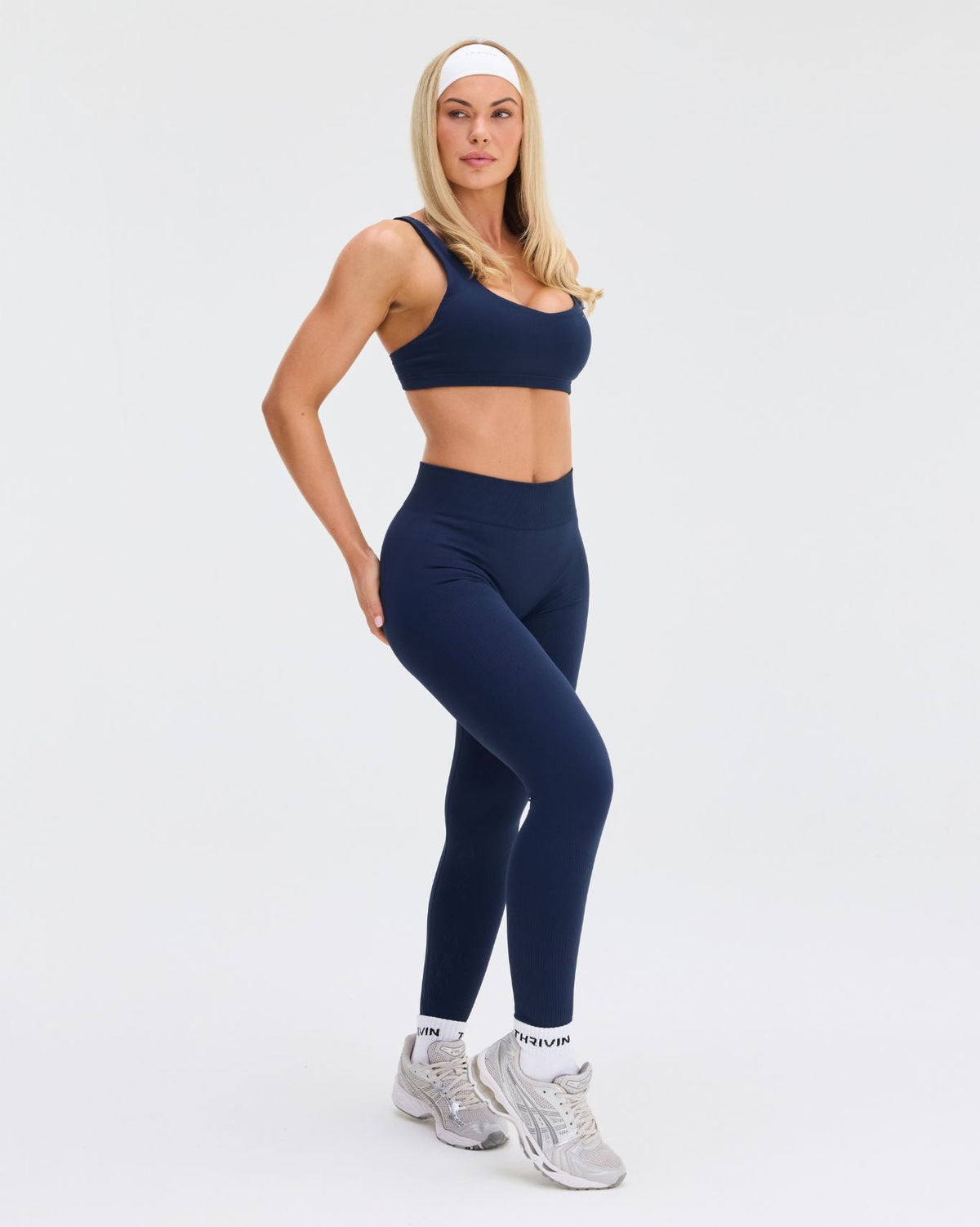 Elevate Sculpting Mid Waist Scrunch Leggings in Midnight Navy Blue, full-length three-quarter front view, high waistband