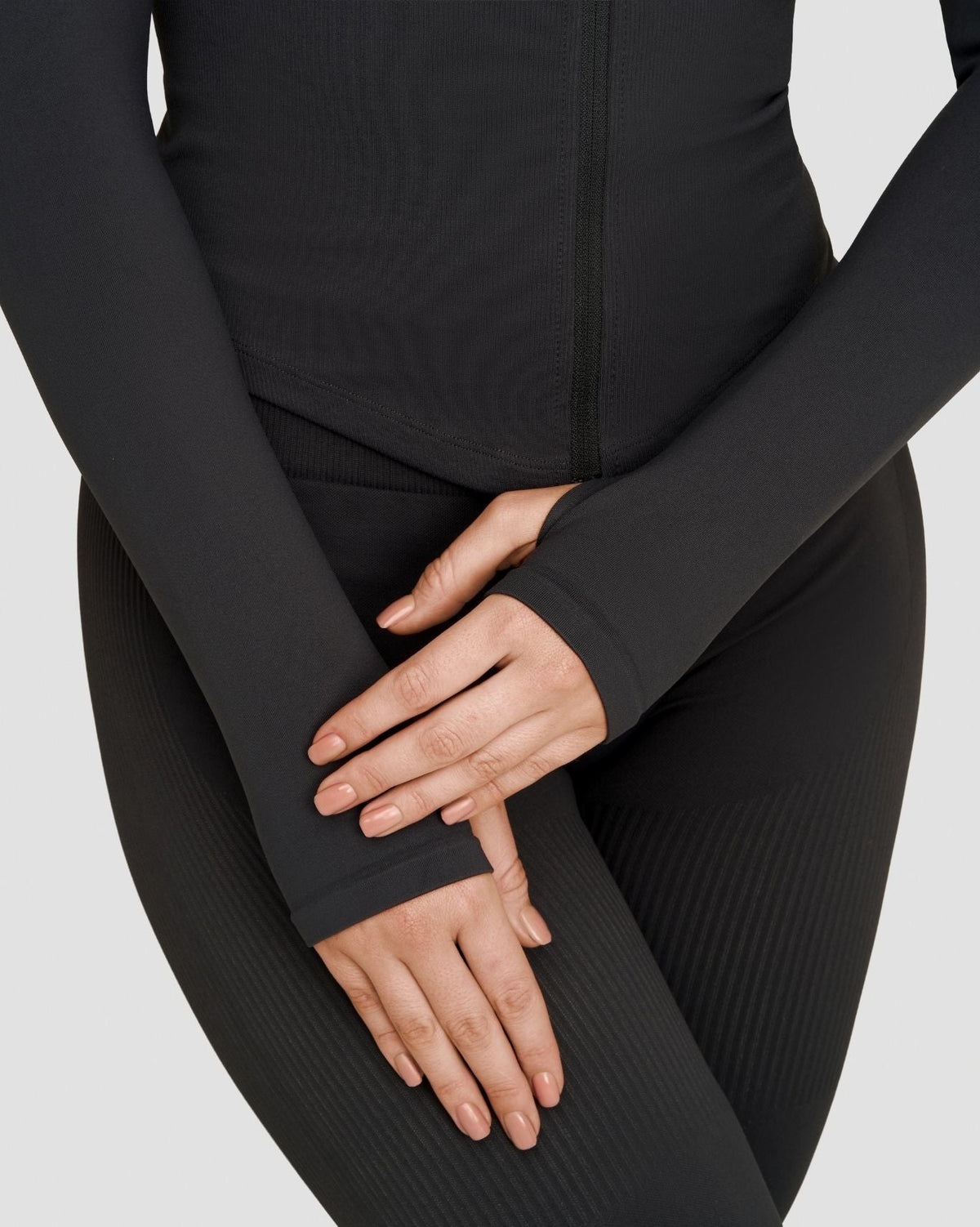 Elevate Compression Long Sleeve Jacket in Charcoal Grey, close-up of thumbhole cuffs and ribbed sleeves