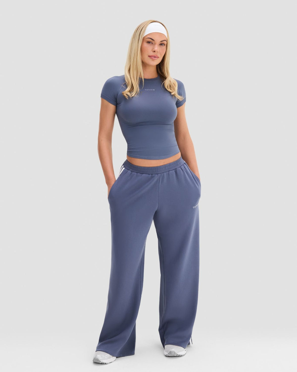 Wide Leg Striped Joggers in Steel Blue, front view with hands in side pockets, styled with a cropped gym T-shirt
