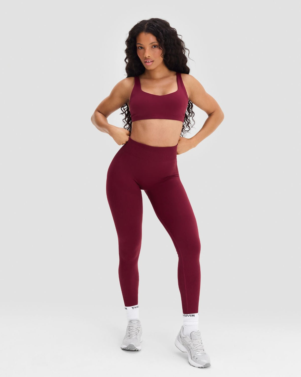 Elevate Sculpting Mid Waist Scrunch Leggings in Fine Wine Red, full-length front view with hands on hips