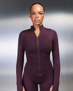 Elevate Compression Long Sleeve Jacket in Winter Plum Red, front view with stand collar, full-length zip and curved hem